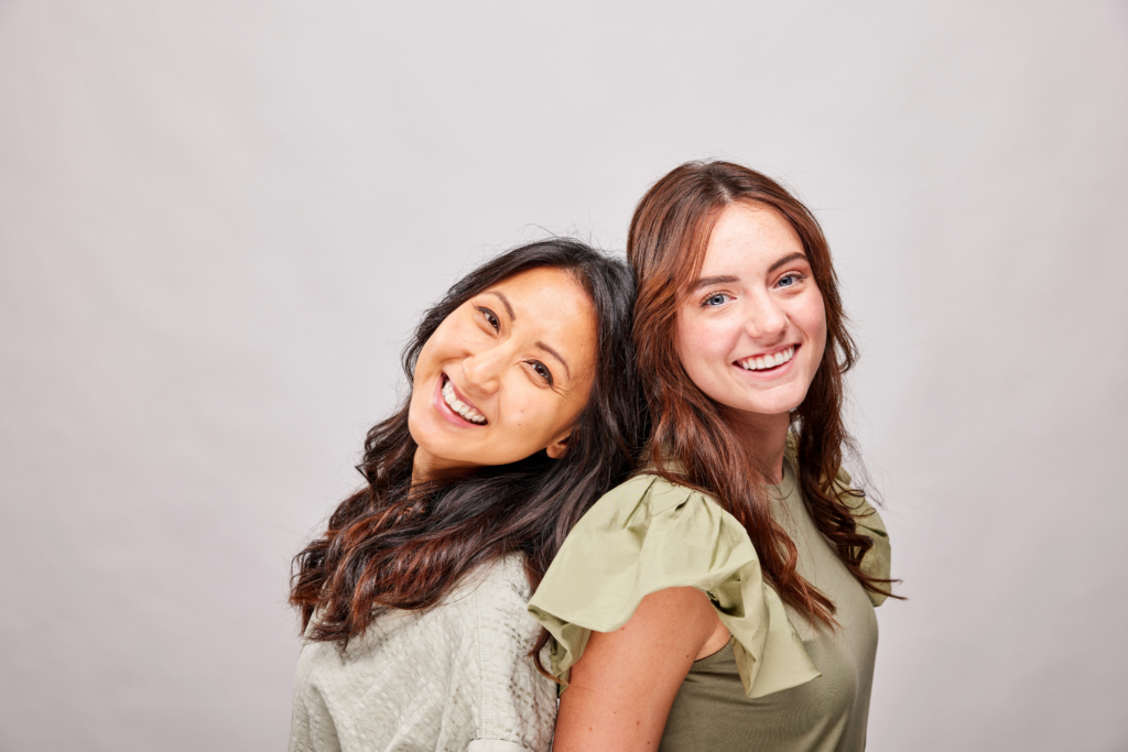young women wearing clear aligners